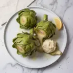 Fresh artichokes ready to be cooked with recipe instructions