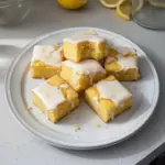 Delicious lemon brownies with a vibrant lemon glaze on top.