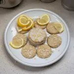 No-bake Lemon Oatmeal Cookies on a plate garnished with lemon slices.
