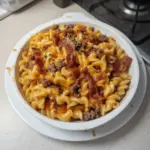 Delicious loaded Bacon Cheeseburger Pasta topped with cheese and bacon.