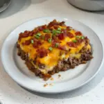 Low carb bacon cheeseburger casserole topped with melted cheese and crispy bacon