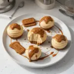 Mini Biscoff cheesecakes topped with cookie crumbles