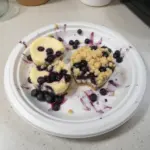Delicious mini blueberry cheesecakes topped with fresh blueberries.