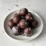 Delicious homemade Oreo Balls topped with chocolate and sprinkles