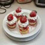 Quick Strawberry Shortcake Cups topped with fresh strawberries and whipped cream
