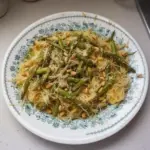 Delicious spaghetti squash dish served with sauce and garnished, healthy recipe.