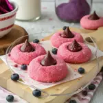 Delicious Strawberry Kiss Cookies topped with a chocolate kiss.