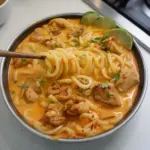 Delicious Thai-inspired coconut red curry chicken udon bowl