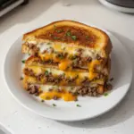 Ultimate Cheesy Ground Beef Melt served with toppings
