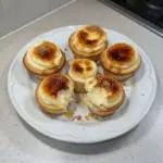 Vanilla Bean Crème Brûlée Cheesecake Cupcakes on a decorative plate
