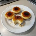 Vanilla bean crème brûlée cupcakes with caramelized sugar topping