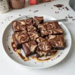 Delicious Vietnamese coffee brownies with a condensed milk swirl on a plate