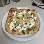 Viral cottage cheese flatbread topped with fresh herbs and spices