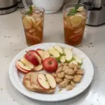 Refreshing Washington® Apple Iced Tea served in a glass with ice and apple slices