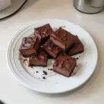 Delicious Chocolate Cheesecake Bars topped with chocolate drizzle
