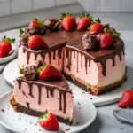 Decadent chocolate covered strawberry cheesecake on a plate