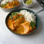 Delicious Coconut Curry Braised Salmon served with vibrant vegetables