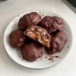 Homemade chocolate turtles featuring caramel and nuts