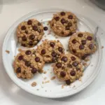 Oatmeal protein cookies stacked on a plate, showcasing their chewy texture.