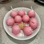 Homemade Starbucks cake pop with colorful sprinkles on a stick