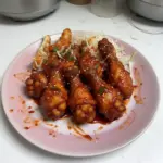 Delicious sticky Gochujang chicken served with rice and veggies
