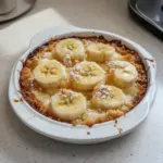 Delicious homemade Southern banana cobbler dessert served in a bowl.