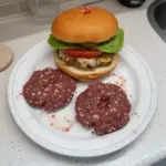 Delicious venison burger on a rustic wooden table