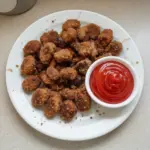 Deliciously crispy venison nuggets served with dipping sauce