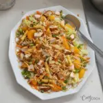 Freshly made Chinese Chicken Salad with vegetables and sesame dressing.