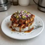 Honey Lime Chicken Stack garnished with lime slices on a plate