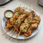 Juicy ranch garlic parmesan chicken skewers served on a platter